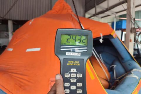 Weight check during load test of Davit Liferafts